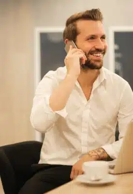 man using smartphone on chair