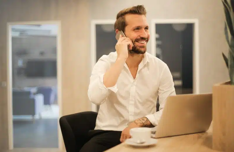 man using smartphone on chair