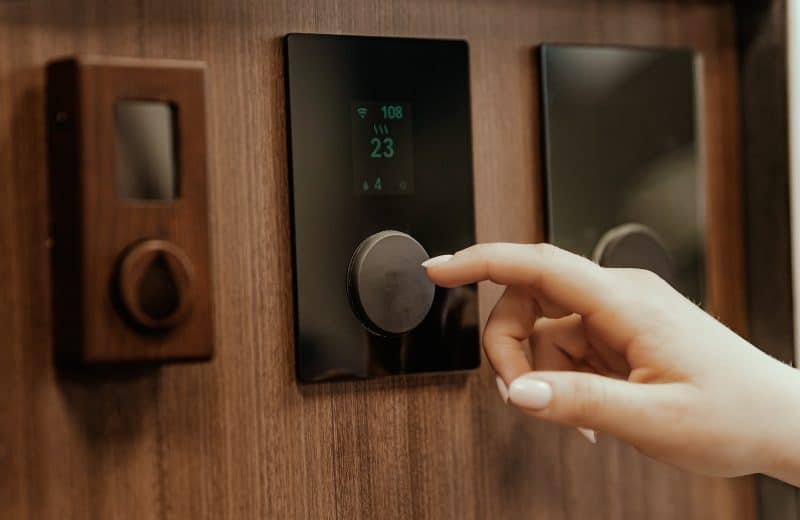a hand pointing at a screen